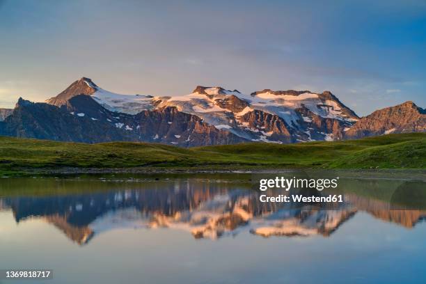 reflection of vanoise massif mountain in lake, vanoise national park, france - vanoise national park stock pictures, royalty-free photos & images