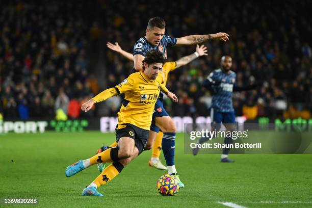 Francisco Trincao of Wolverhampton Wanderers is fouled by Granit Xhaka of Arsenal during the Premier League match between Wolverhampton Wanderers and...