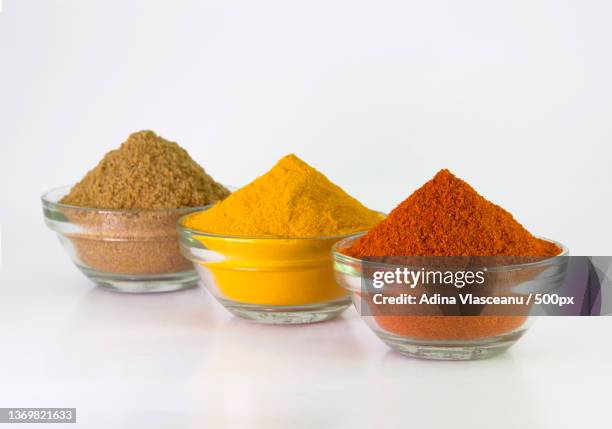 chili,turmeric coriander in bowl isolated on white background - curry powder stock pictures, royalty-free photos & images