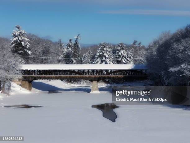 snow covered saco bridge,scenic view of snow covered field against sky,conway,new hampshire,united states,usa - deer river new hampshire stock pictures, royalty-free photos & images