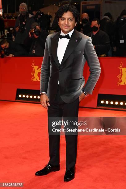 Berlinale 2022 International Jury President and US filmmaker M. Night Shyamalan arrive for the "Peter von Kant" premiere and Opening Ceremony during...