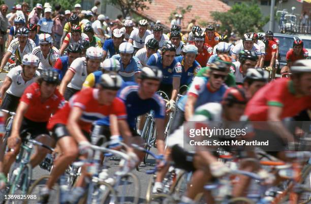 Cyclists make their way through the town of Mission Viejo during the Men's Cycling Road Race at the 1984 Summer Olympics, Mission Viejo, California,...