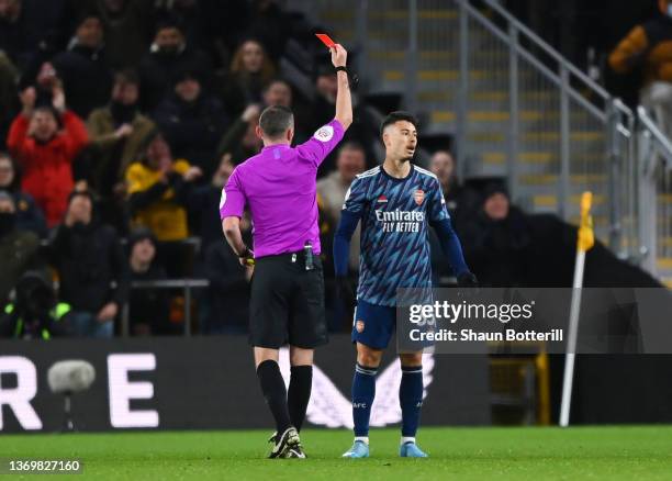 Gabriel Martinelli of Arsenal is shown a red card by referee Michael Oliver during the Premier League match between Wolverhampton Wanderers and...