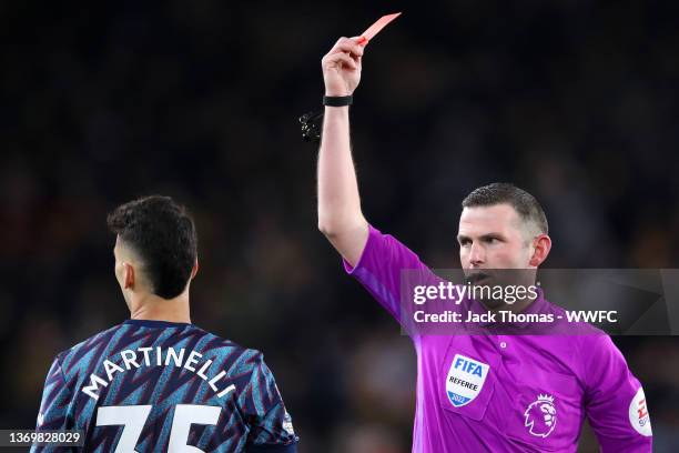 Match Referee, Michael Oliver shows a red card to Gabriel Martinelli of Arsenal during the Premier League match between Wolverhampton Wanderers and...