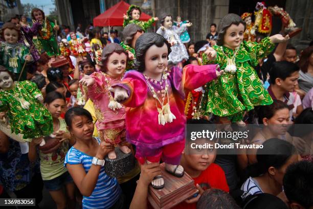 Catholic devotees celebrate the feast of Santo Nino with various religious images of the Child Jesus in a grand procession dubbed "Lakbayaw" from the...