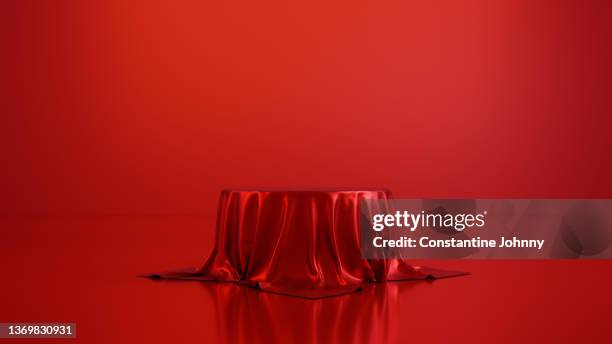 table or podium display stand covered with red silk - winners podium stock-fotos und bilder