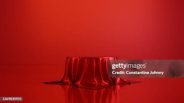 table or podium display stand covered with red silk - pedestal stock pictures, royalty-free photos & images
