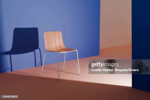 minimal interior of living room with chair and natural light, blue and orange colors - modern minimal living room stock-fotos und bilder