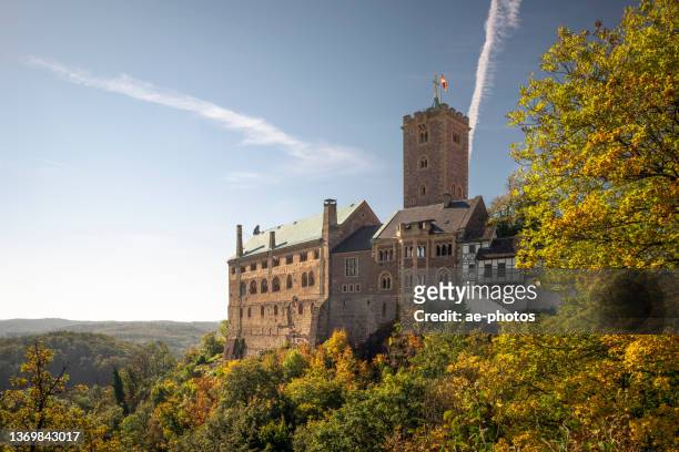 the wartburg castle in autumn - eisenach stock pictures, royalty-free photos & images