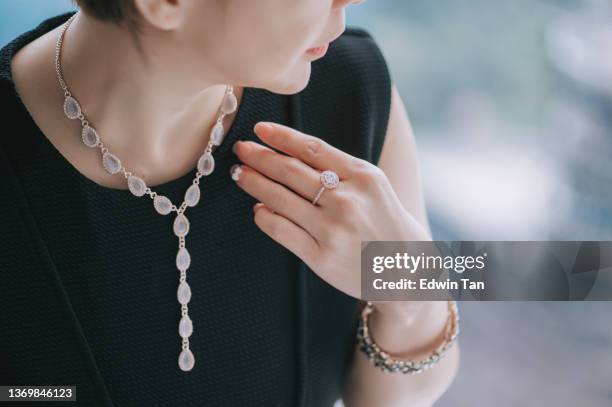 close up asian chinese woman with jewelry necklace - woman diamond necklace stock pictures, royalty-free photos & images