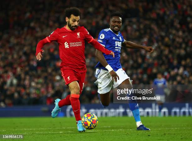 Mohamed Salah of Liverpool battles for possession with Daniel Amartey of Leicester City during the Premier League match between Liverpool and...