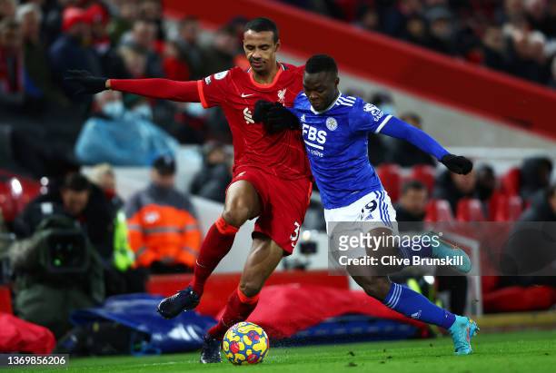 Joel Matip of Liverpool battles for possession with Patson Daka of Leicester City during the Premier League match between Liverpool and Leicester...