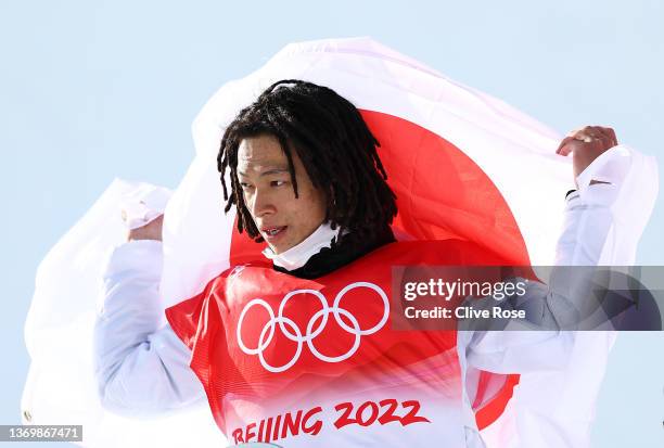 Gold medallist Ayumu Hirano of Team Japan celebrates during the Men's Snowboard Halfpipe flower ceremony on day 7 of the Beijing 2022 Winter Olympics...