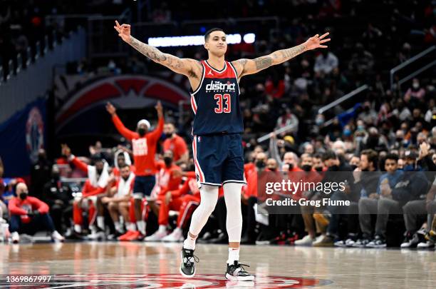 Kyle Kuzma of the Washington Wizards celebrates during the third quarter against the Brooklyn Nets at Capital One Arena on February 10, 2022 in...