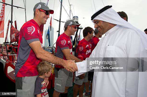 With Emirates Team New Zealand co skipper Stu Bannatyne shakes hands with His Highness Sheikh Sultan Bin Tahnoon Al Nahyan - Chairman of the Abu...