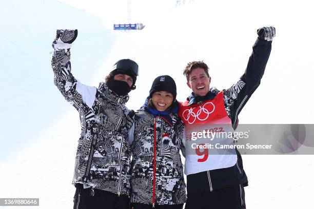 Shaun White of Team United States poses for a photo with their coach, JJ Thomas and Physical Therapist Dr. Esther Lee after finishing fourth during...