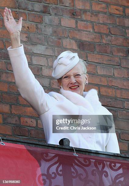 Queen Margrethe II of Denmark waves from the balcony of City Hall after the official reception to celebrate 40 years on the throne at City Hall on...