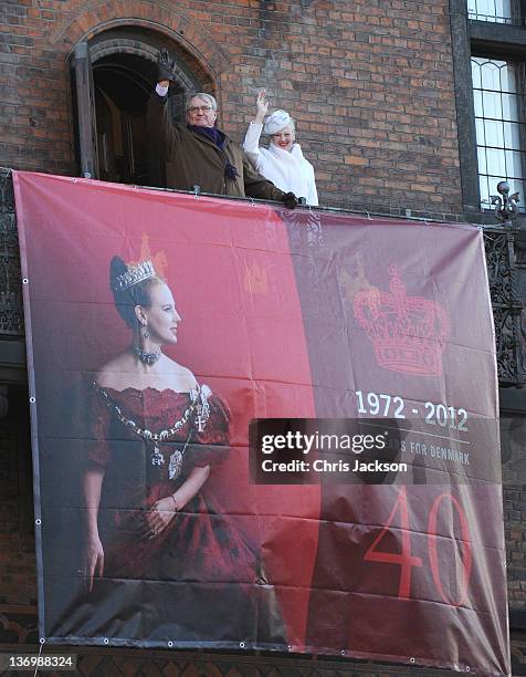 Prince Henrik of Denmark and Queen Margrethe II of Denmark wave to the crowd during the official reception to celebrate 40 years on the throne at...