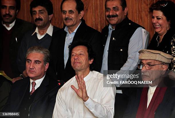 Former Pakistani cricketer turned politician Imran Khan and his party leader former foreign minister Shah Mehmood Qureshi address a press conference...