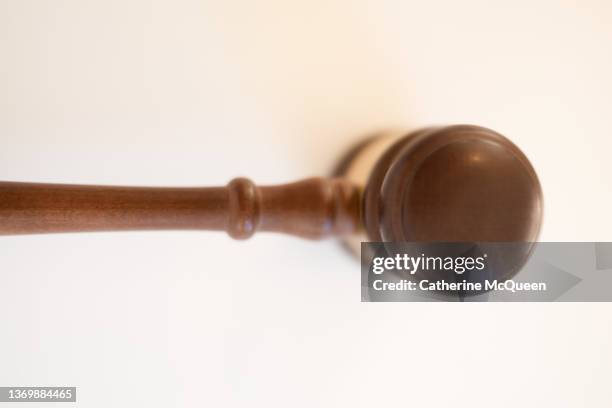 judge’s traditional wooden gavel on white background - supreme court hearing stock pictures, royalty-free photos & images