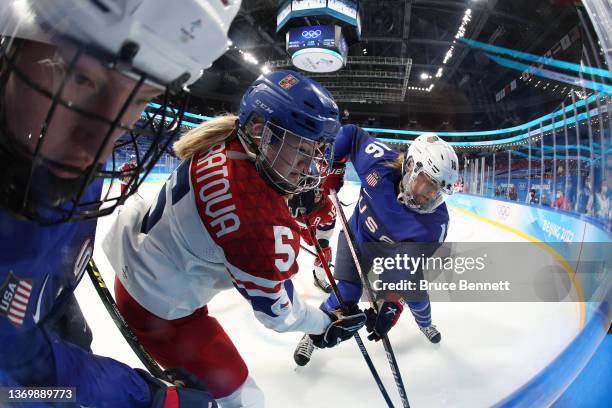 Samantha Ahn Kolowratova of Team Czech Republic and Hayley Scamurra of Team United States vie for the puck in the corner in the third period during...