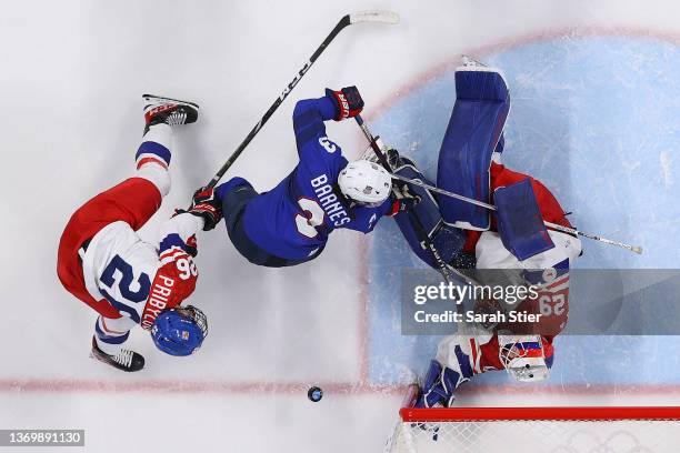 Goaltender Klara Peslarova of Team Czech Republic makes a save on Cayla Barnes of Team United States in the third period during the Women's Ice...