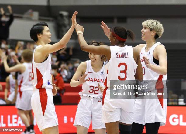 Players of Japan celebrate their victory in the FIBA Women's World Cup Qualifying Tournament game between Japan and Canada at Ookini Arena Maishima...