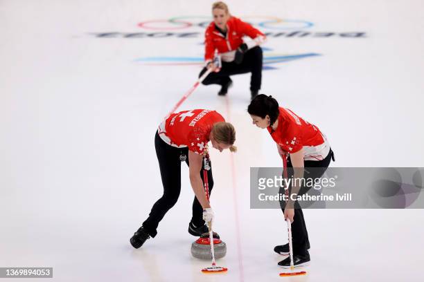 Melanie Barbezat, Silvana Tirinzoni and Esther Neuenschwander of Team Switzerland compete against Team ROC during the Women's Round Robin Curling...