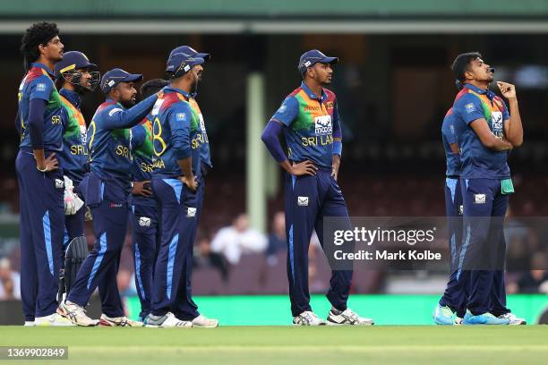 Maheesh Theekshana of Sri Lanka and his team mates react as not out is given after their DRS call during game one in the T20 International series...