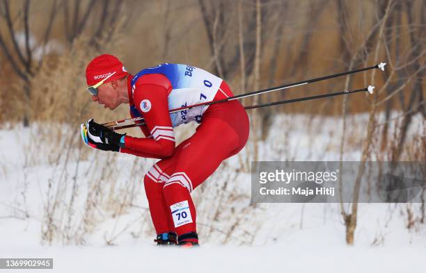 Alexander Bolshunov of Team ROC competes during the Men's Cross-Country Skiing 15km Classic on Day 7 of Beijing 2022 Winter Olympics at The National...