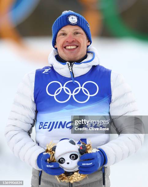 Gold medallist Iivo Niskanen of Team Finland poses during the Men's Cross-Country Skiing 15km Classic flower ceremony on Day 7 of Beijing 2022 Winter...