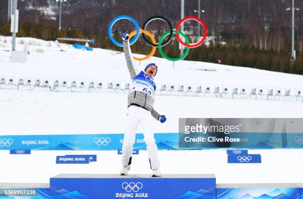 Gold medallist Iivo Niskanen of Team Finland celebrates during the Men's Cross-Country Skiing 15km Classic flower ceremony on Day 7 of Beijing 2022...