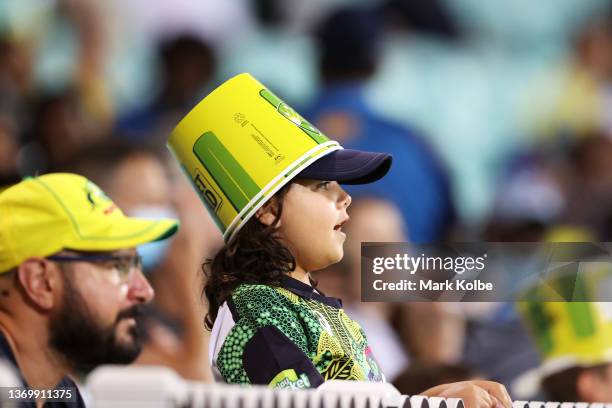 Young supporter in the crowd watches on during game one in the T20 International series between Australia and Sri Lanka at Sydney Cricket Ground on...