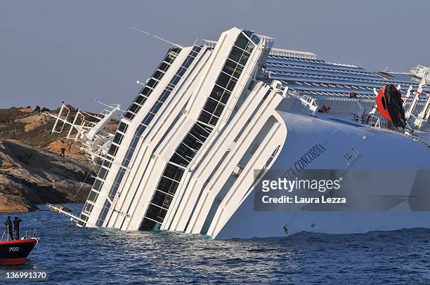 The cruise ship Costa Concordia lies stricken off the shore of the island of Giglio, on January 14, 2012 in Giglio Porto, Italy. More than four...