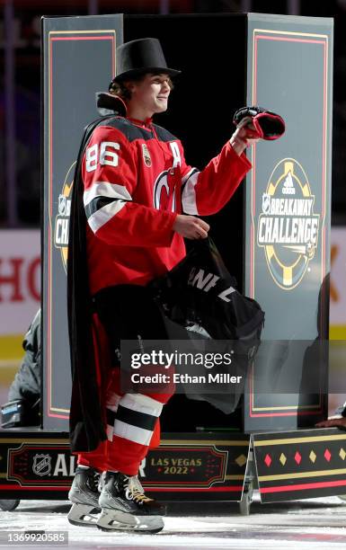 Jack Hughes of the New Jersey Devils performs a magic trick as he competes in the Breakaway Challenge during the 2022 NHL All-Star Skills at T-Mobile...