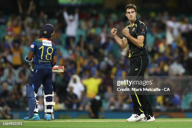 Pat Cummins of Australia celebrates taking the wicket of safduring game one in the T20 International series between Australia and Sri Lanka at Sydney...