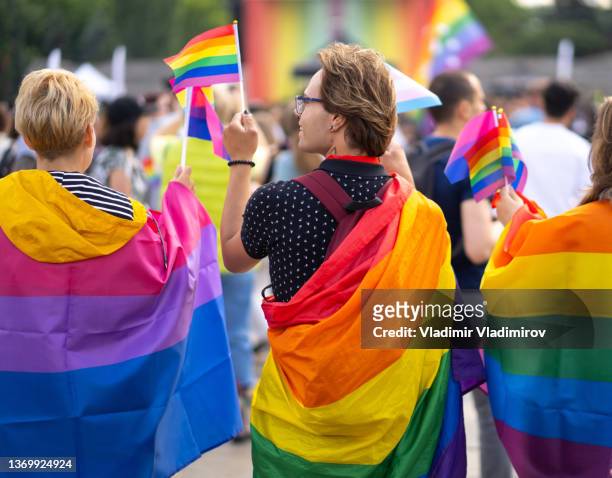 watching a pride parade - male protestor stock pictures, royalty-free photos & images