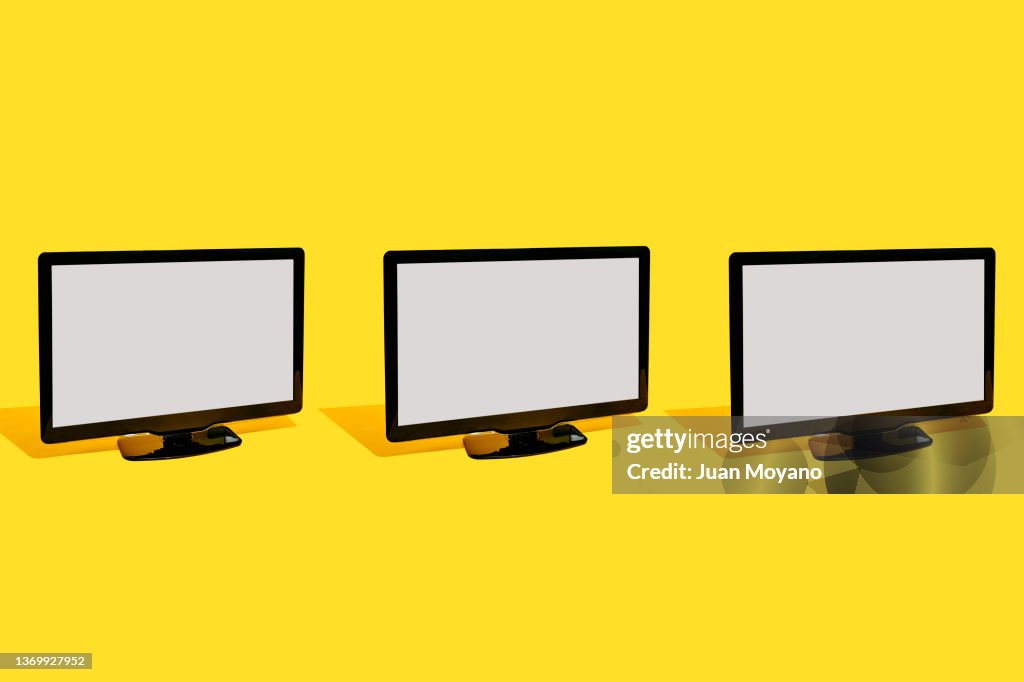Three flat screen television sets