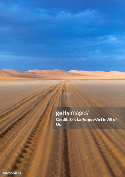Car tracks in Rub al Khali, Najran Province, Thar, Saudi Arabia on December 30, 2021 in Thar, Saudi Arabia.