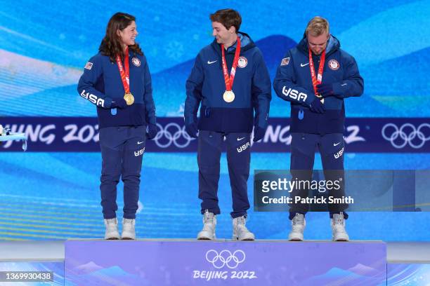 Gold medallists, Ashley Caldwell, Christopher Lillis and Justin Schoenefeld of Team United States celebrate on the podium during the Freestyle Skiing...