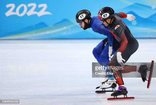 Denis Nikisha of Team Kazakhstan and Jordan Pierre-Gilles of Team Canada compete at the finish line during the Men's 500m Heats on day seven of the...