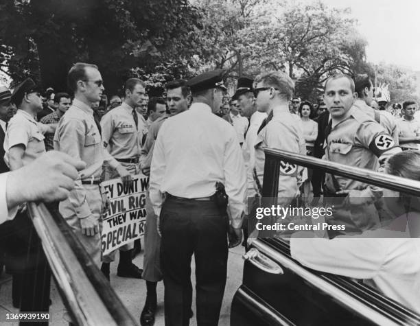 Police talks to members of the American Nazi Party, who tried to disrupt a civil rights movement demonstration in Washington DC, US, 18th June 1963.