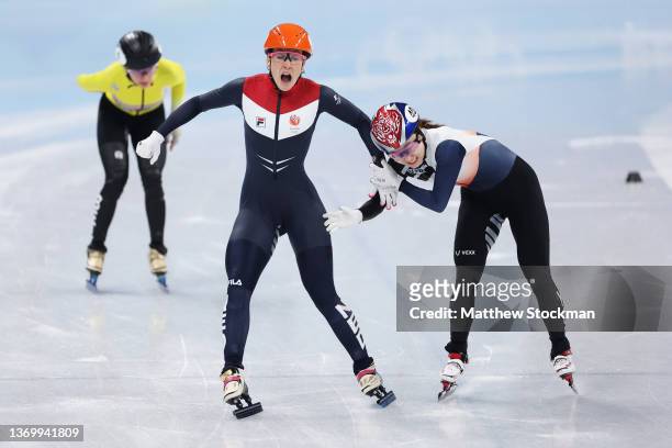 Suzanne Schulting of Team Netherlands and Minjeong Choi of Team South Korea compete as they cross the finish line during the Women's 1000m Final A on...