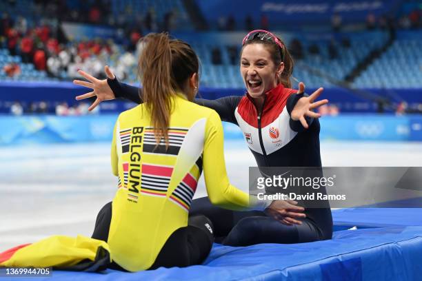 Gold medallist Suzanne Schulting of Team Netherlands celebrates with Bronze medallist Hanne Desmet of Team Belgium after the Women's 1000m Final A on...