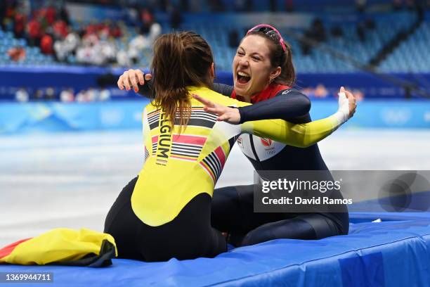 Gold medallist Suzanne Schulting of Team Netherlands celebrates with Bronze medallist Hanne Desmet of Team Belgium after the Women's 1000m Final A on...