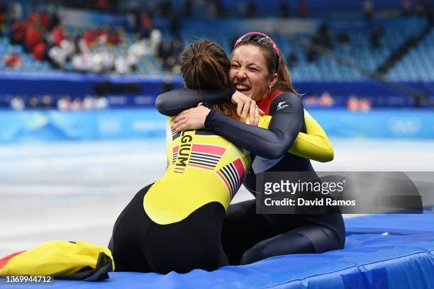 Gold medallist Suzanne Schulting of Team Netherlands celebrates with Bronze medallist Hanne Desmet of Team Belgium after the Women's 1000m Final A on...