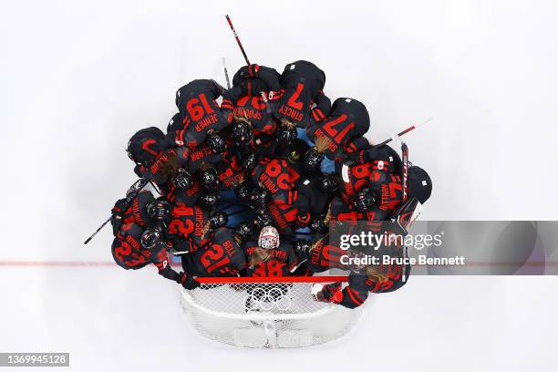 Team Canada huddles prior to the start of the game against Team Sweden during the Women's Ice Hockey Quarterfinal match on Day 7 of the Beijing 2022...