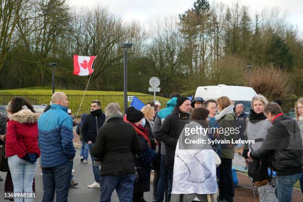 French anti-COVID restrictions protesters wave national Canadian flag during a breakfast as they gather in northern France before the start of their...