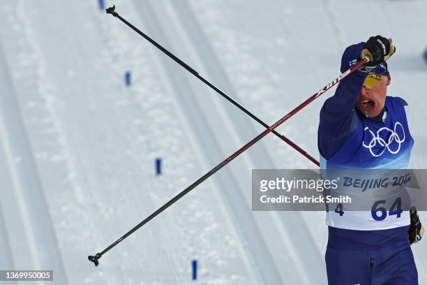 Iivo Niskanen of Team Finland reacts after crossing the finish line during the Men's Cross-Country Skiing 15km Classic on Day 7 of Beijing 2022...