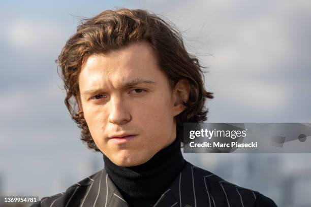 Actor Tom Holland attends the "Uncharted" photocall at cinema Publicis Champs-Elysees on February 11, 2022 in Paris, France.